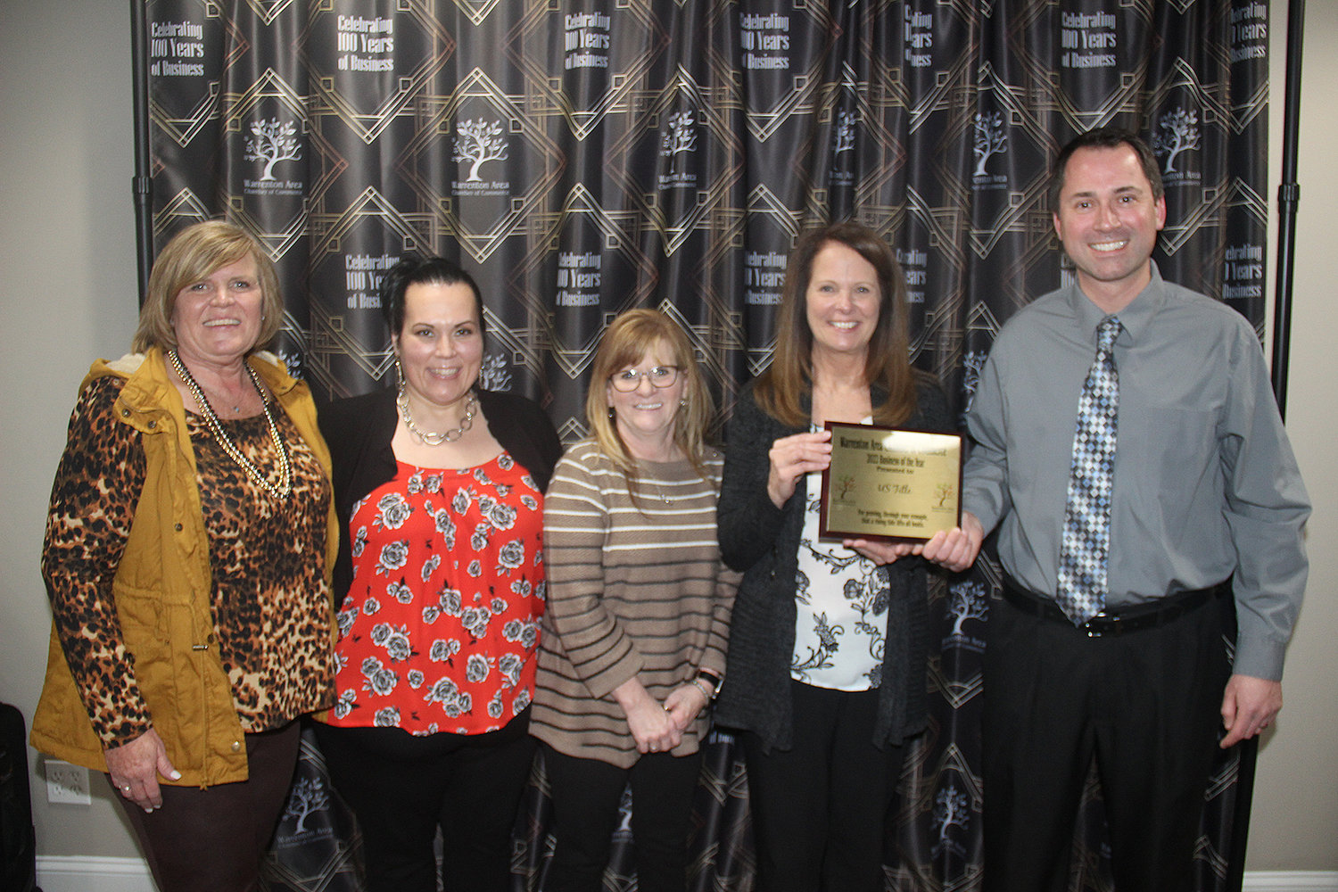 BUSINESS OF THE YEAR — Recorder Christy Bonstell and Mindy Kimler, Tracy Smith and Jeanette Hooton of U.S. Title accept the business of the year award from board member Dan Dieckmann.