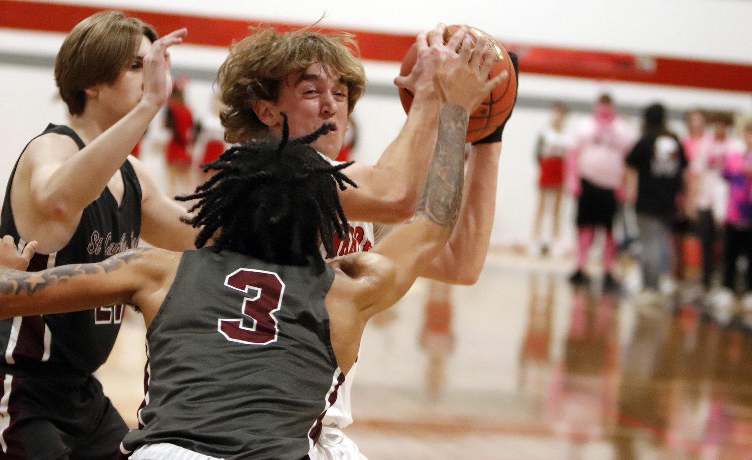 Warrenton senior Kannon Hibbs battles through two St. Charles West defenders during Friday night’s conference matchup at Warrenton High School.