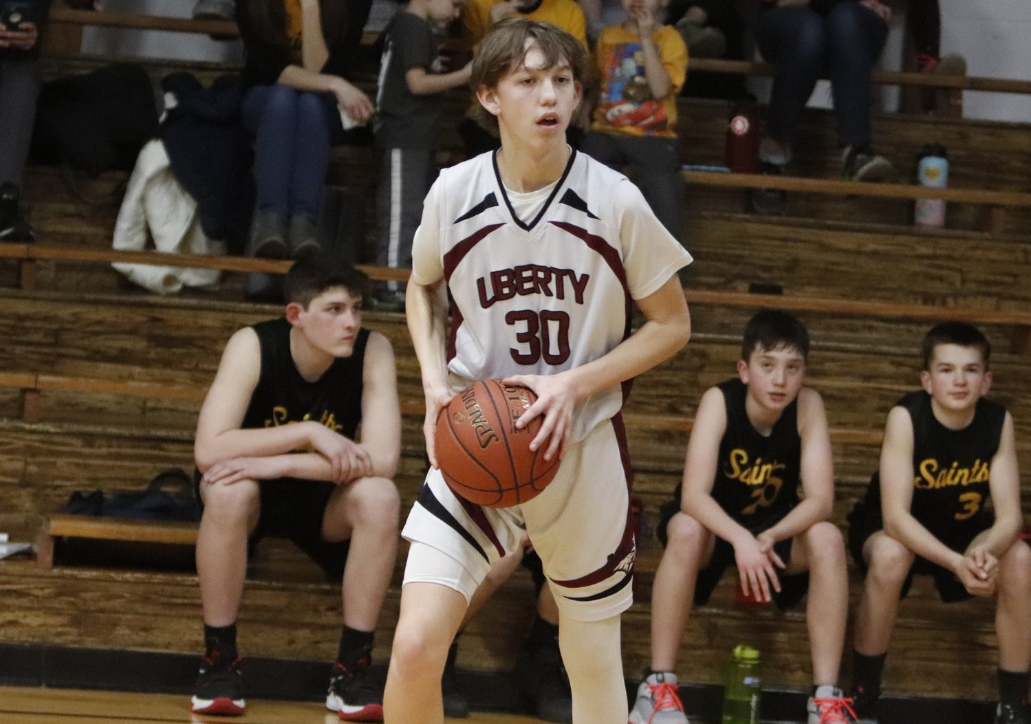 Liberty Christian freshman Tommy Meyer looks to pass to a teammate during the first half of Liberty Christian’s win over Quincy Home School Tuesday.