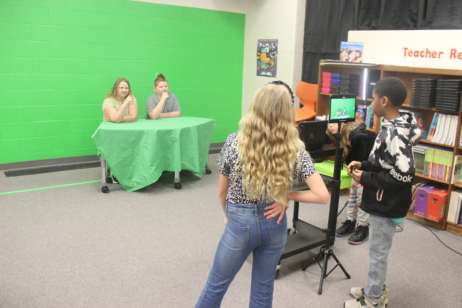 MAKING THE MAGIC HAPPEN — A group of fifth grade students fulfill the roles of anchors, videographers and production assistants for a daily news video at Rebecca Boone Elementary. Students can learn about presentation, writing, and video editing by taking part.