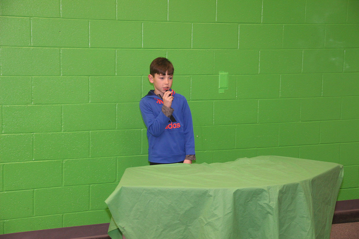 AND NOW, THE WEATHER — Rebecca Boone fifth grader Ryder Augusta delivers the day's weather forecast as part of daily, student-produced news videos at the school. Students script, film and edit the videos largely on their own.