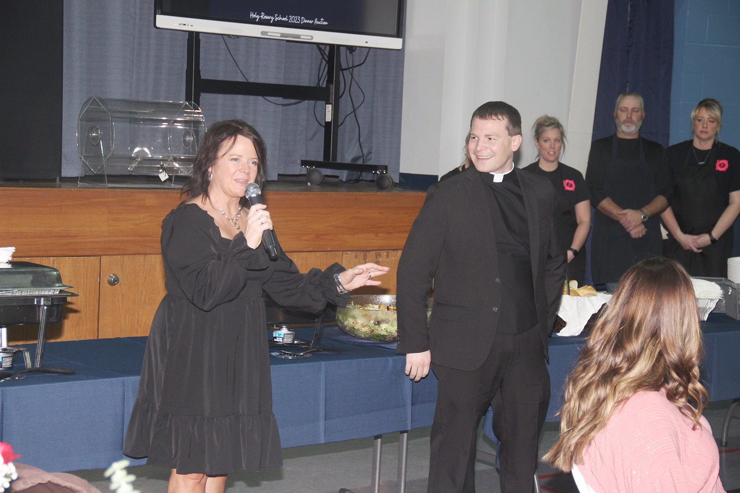 THANKFUL ADMINS — Holy Rosary School Principal Lori Racine and Pastor Tom Vordtriede thank guests at the school’s annual dinner and auction Jan. 28, explaining that their support is part of an active and thriving community.