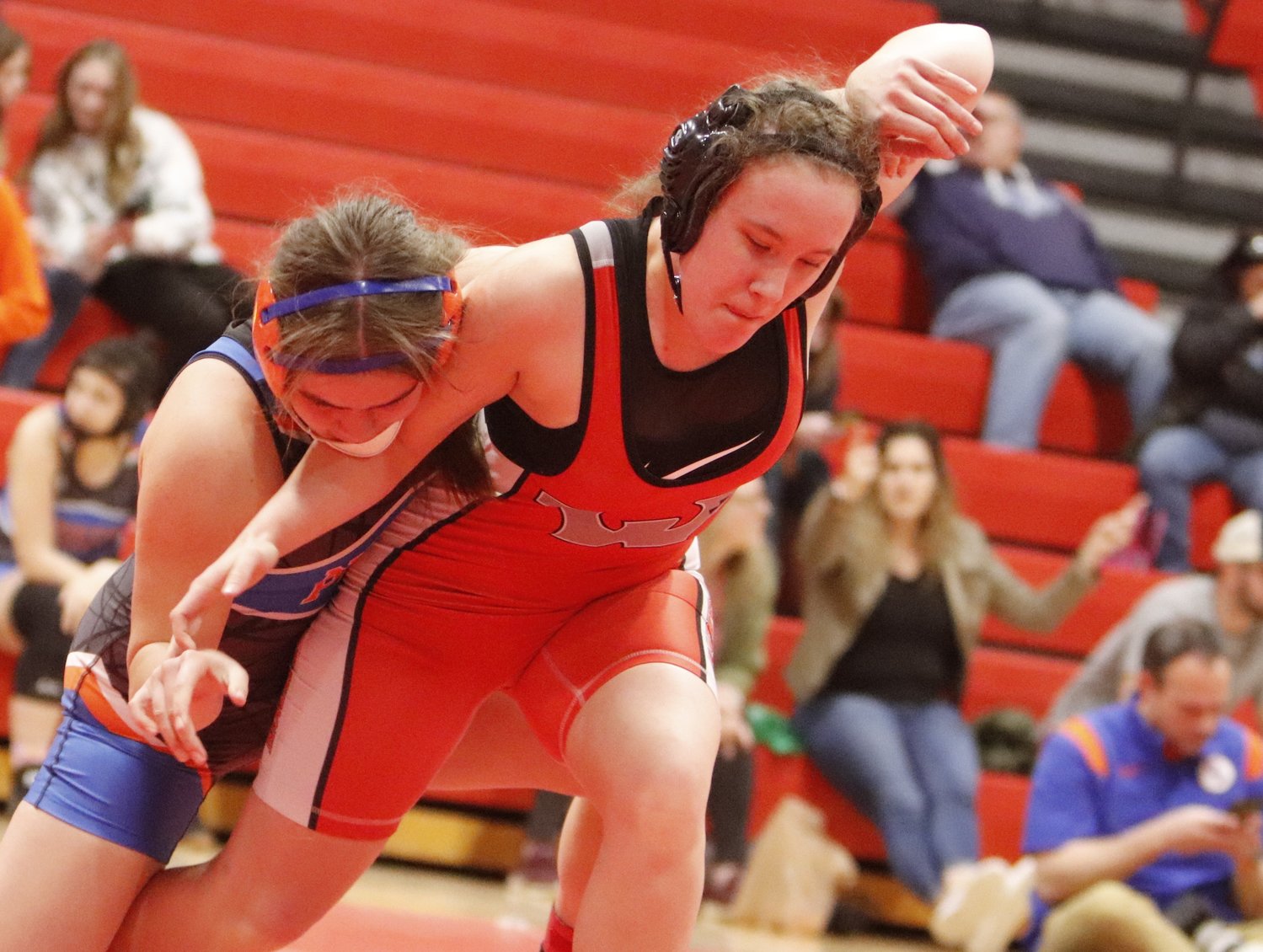 Madisen Nash (right) attempts to elude the grasp of North Point wrestler Caroline Frank during Tuesday's match.