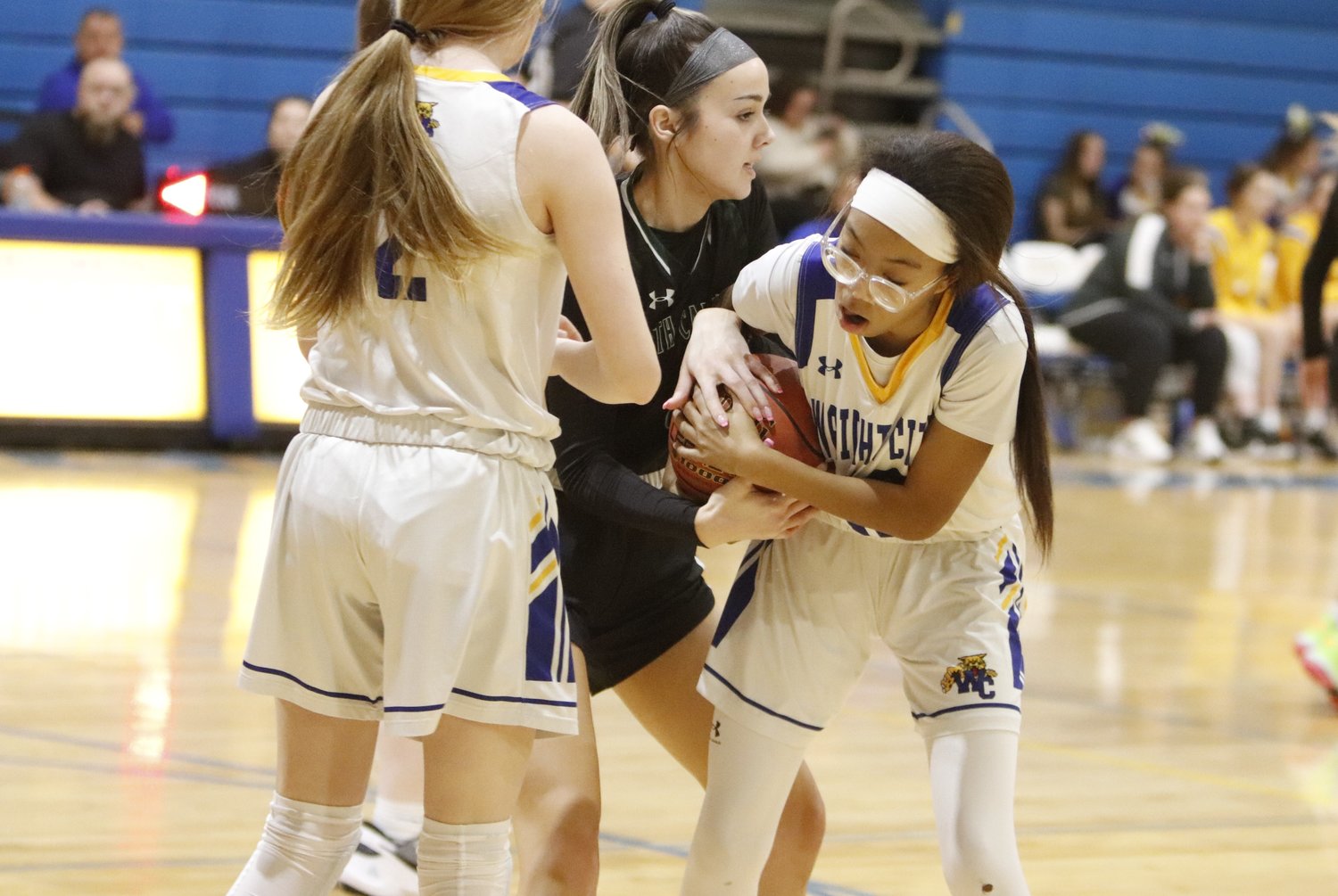 Danika Graham (right) battles for possession of the ball during Monday night's game.