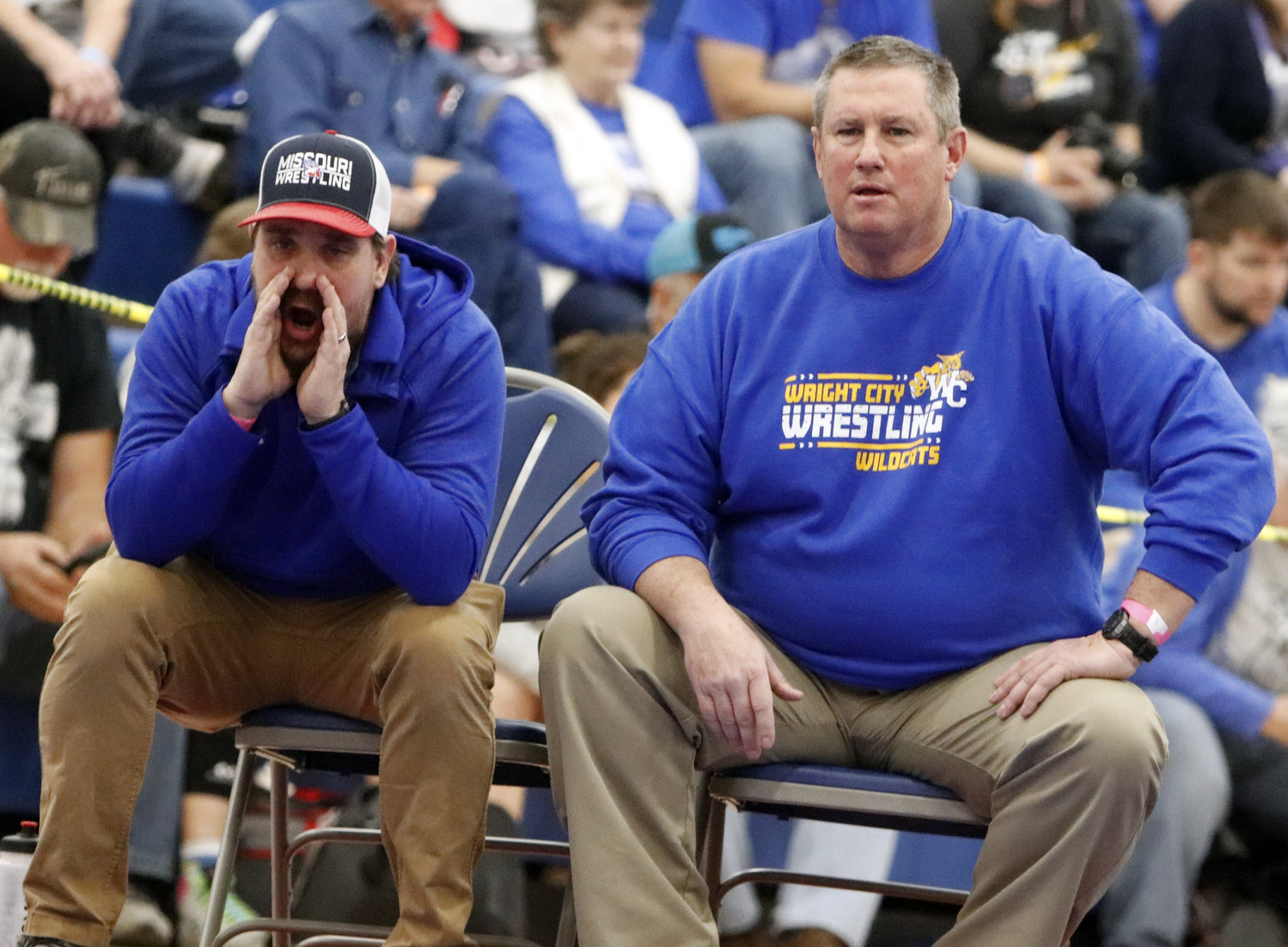 Wright City wrestling coaches look on during Saturday's district wrestling tournament.