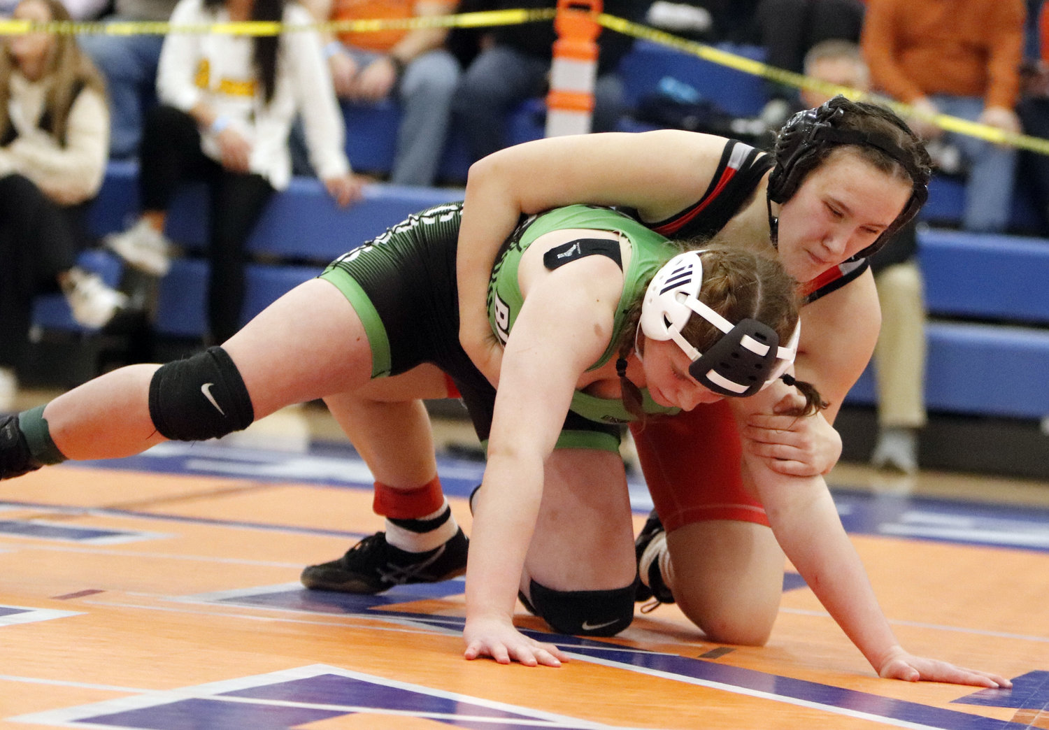 Madisen Nash (right) attempts to bring down Blair Oaks wrestler Sam Lage during Saturday's Class 1, District 2 wrestling tournament.