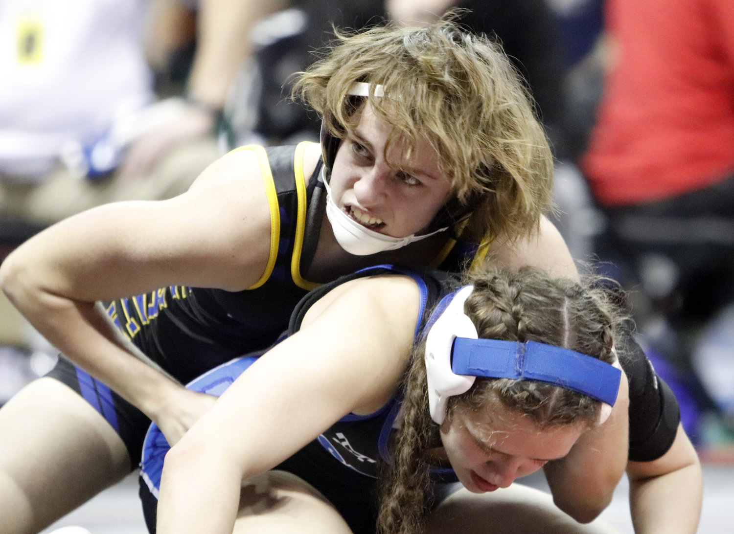 Wright City freshman Kali Jensen (top) wrestles against Louzella Graham during the opening round of the state tournament. Jensen won her last two matches of the day and will wrestle in the third round wrestlebacks tomorrow.