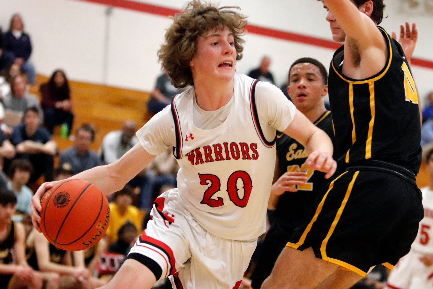 Warrenton guard Troy Anderson (left) attempts to drive past the Ft. Zumwalt East defense during the first half of Wednesday night's game. Anderson led Warrenton with 19 points.