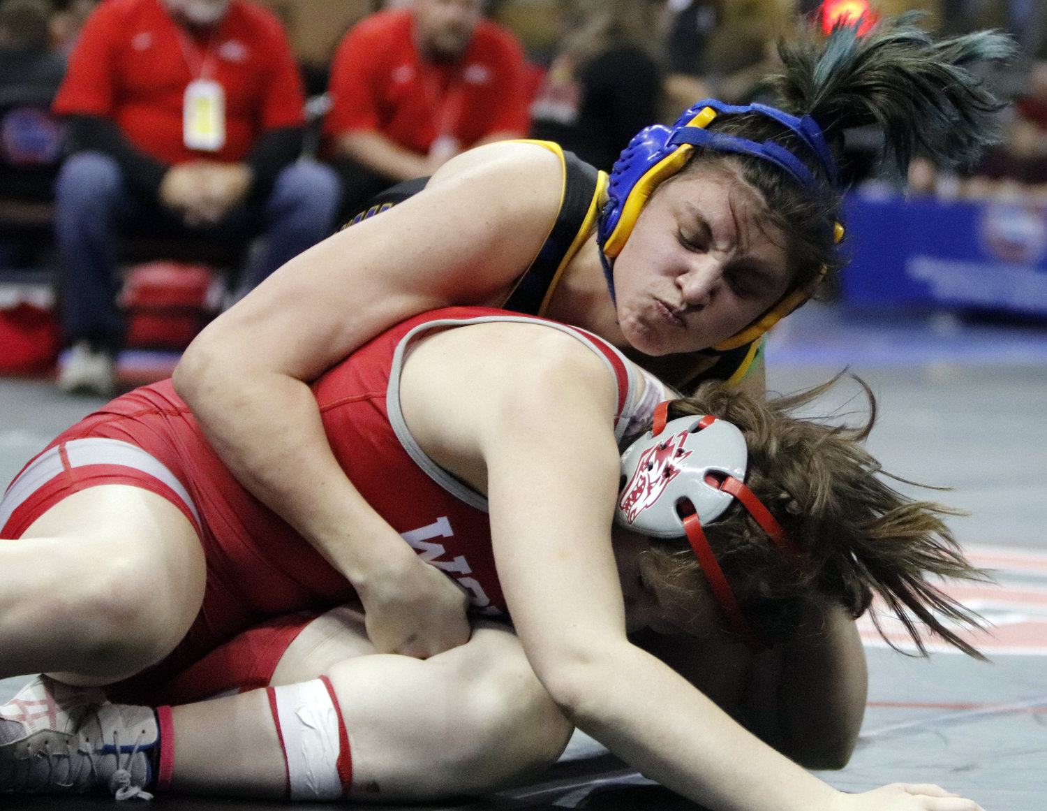 Wright City sophomore Caelyn Hanff (top) maintains control of Reeds Spring wrestler Blaiklee Cagle during her quarterfinal match.