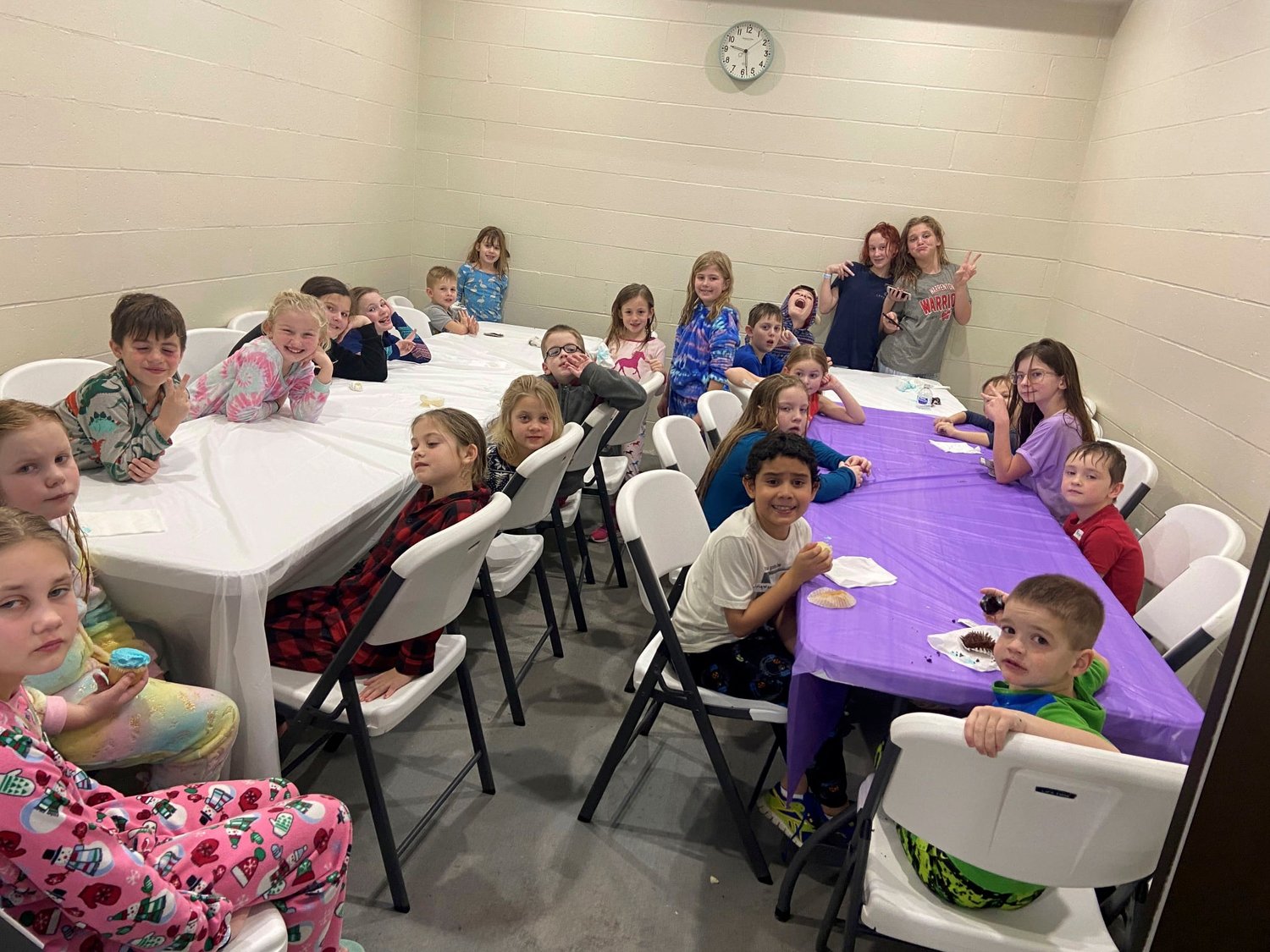 Kids wind down after an evening swimming at the 2022 Splash 'N Pajama party at the Warrenton Aquatic Center.