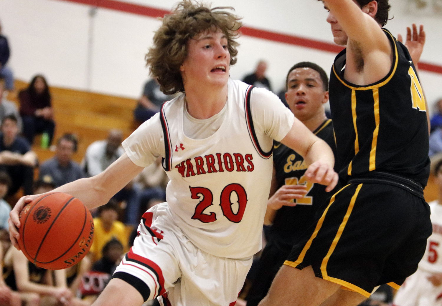 Warrenton guard Troy Anderson (left) drives towards the basket during the first half of last week’s district win over Ft. Zumwalt East. Anderson led the Warriors with 19 points in the win.