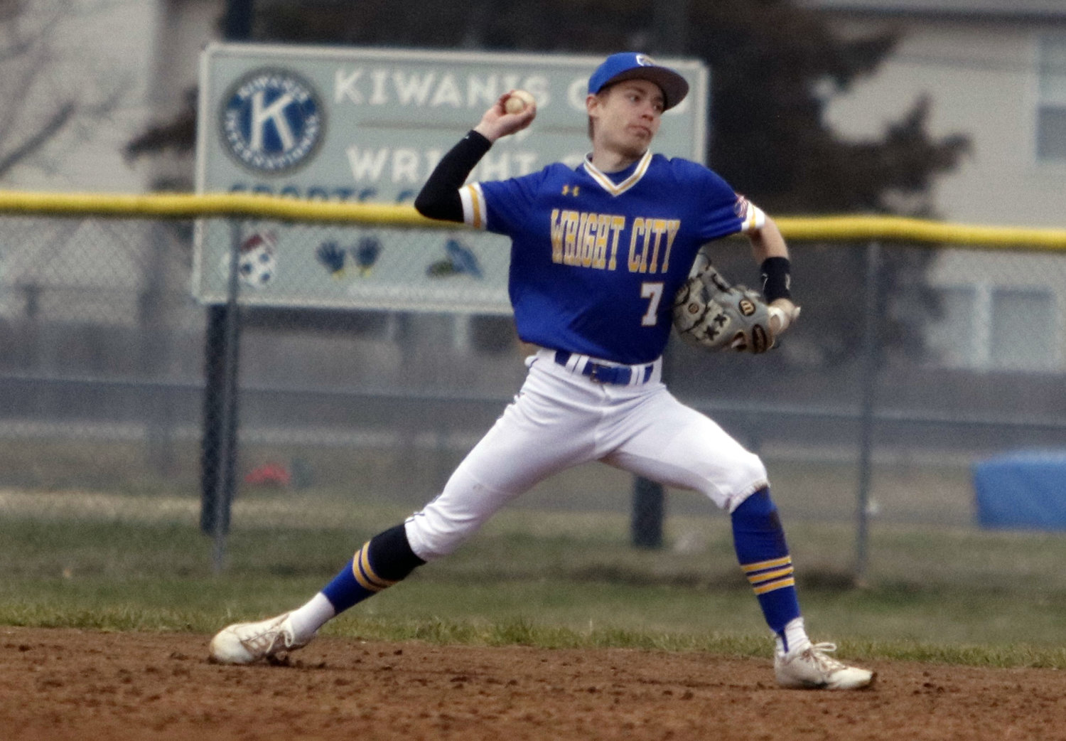 Wright City second baseman Devin Foust throws the ball to first base after making a diving stop in the seventh inning of Wright City’s loss to Rockwood Summit last week.