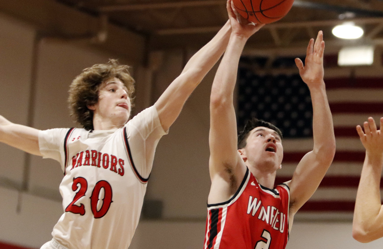 Warrenton junior Troy Anderson reaches to block Winfield guard Brady Creech’s shot during a conference matchup earlier this season.