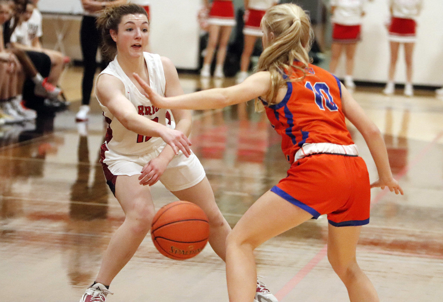 Warrenton senior Audrey Payne (left) passes a ball into the post during a regular season game against North Point earlier this season. Payne was one of two Lady Warriors named to the GAC North all-conference first team.