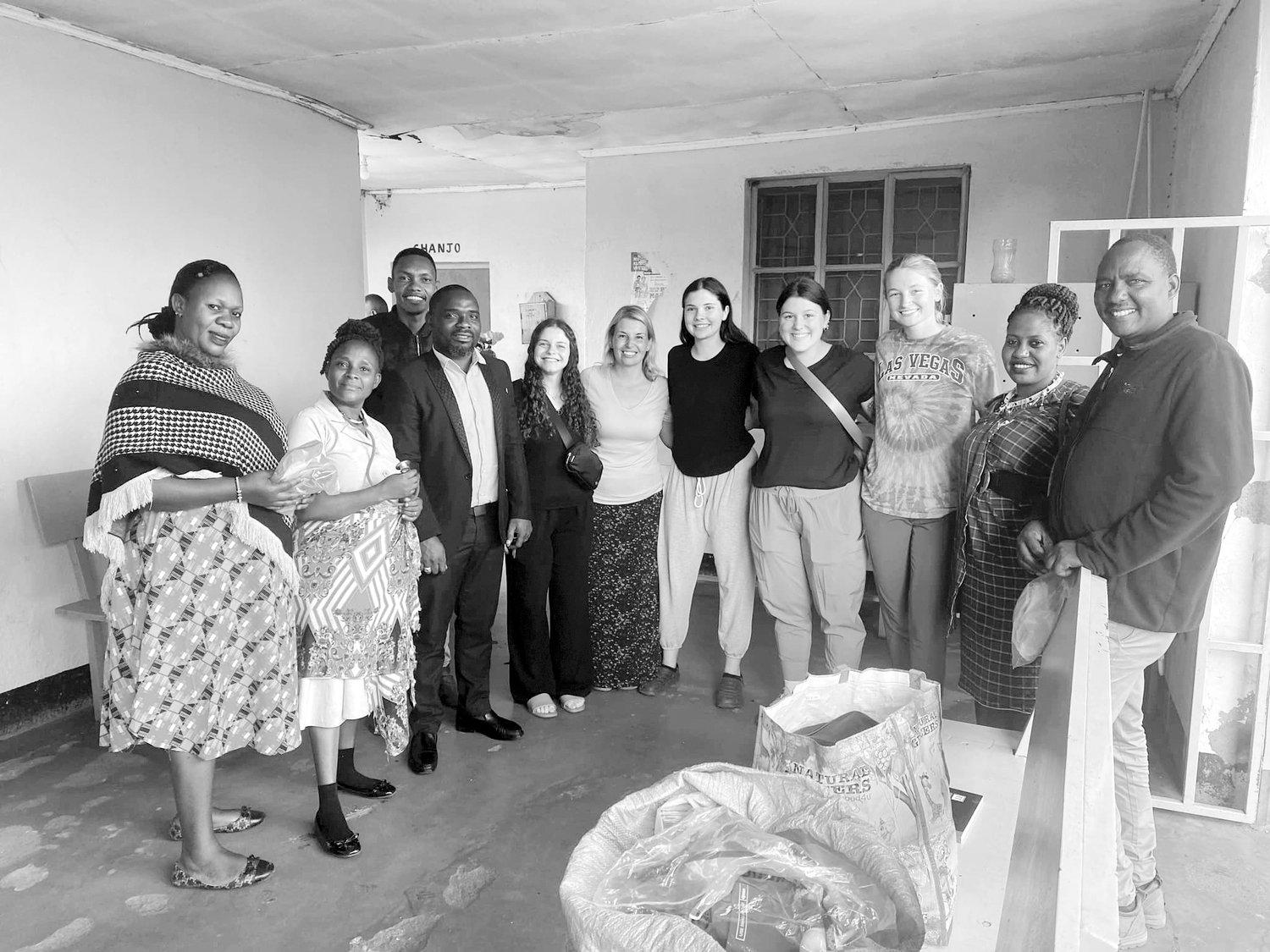AFRICA VISIT — Wright City native Riley Heiliger, fourth from the right, poses with residents in Tanzania as part of a mission trip with Humanity for Children. The trip helped bring public health information to the country’s women.