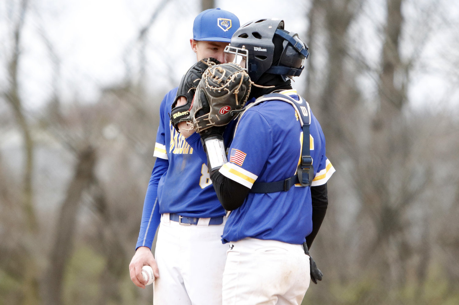Wright City starting pitcher Trey Brakensiek (left) meets with catcher Jack Goughenour during the early innings of Saturday's game.