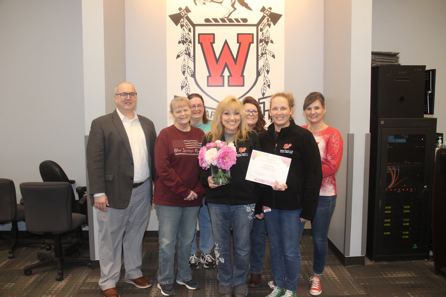 Lucy Swailes, center, is Warren County R-III School District’s Support Staff of the Year. Swailes is a staff member at the district’s Central Office, and was joined by her coworkers to congratulate her for the award. Pictured, from left, are Superintendent Gregg Klinginsmith and staff members Sherry Thompson, Kim Moeller, Swailes, Thea Etcher, Julie Corrigan and Becky Toebber. Not pictured: Carrie Strunk.