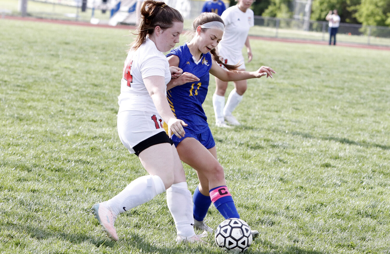 Paige Kirn (right) attempts to gain possession of the ball during the first half of last week's game.