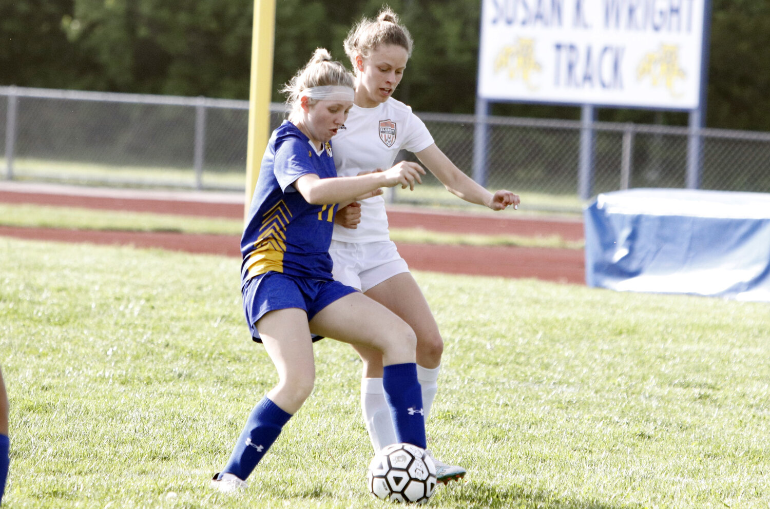 Charleigh Ferrell (left) attempts to maintain possession of the ball during last week's loss to Elsberry.