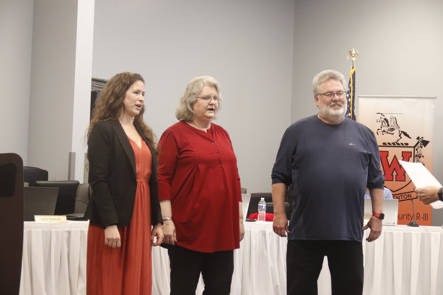 Oath of Office: Carolyn Spraggs (left), Franci Schwartz and Rich Barton (right) take the oath of office at the Warren County R-III school board reorganizational meeting last week.