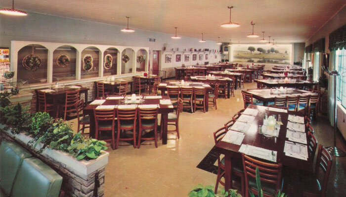 NOW JUST A MEMORY — This view of Big Boy’s Restaurant, preserved on a 1964 postcard, shows how the Chaney farm mural helped set an inviting mood for visitors in the restaurant’s heyday. The business closed in 2005 and years later was demolished.