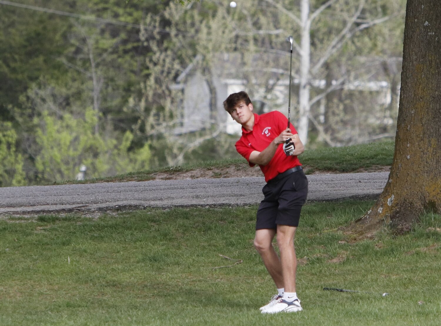 Maison Rader hits an approach shot during Tuesday's golf meet against St. Charles West.