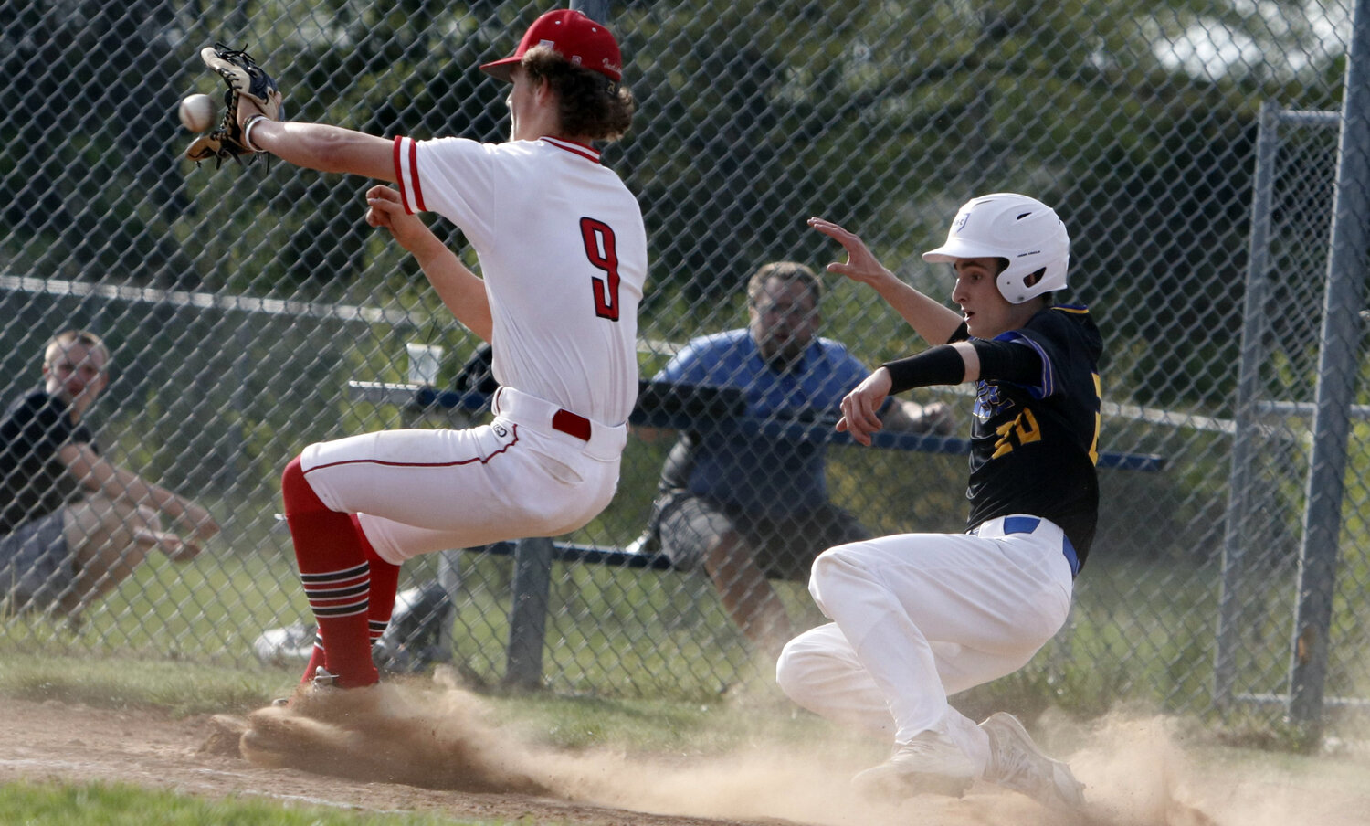Wright City's Micah Boeckman slides towards home plate during last week's game against Elsberry. Boeckman was ruled safe on the play.