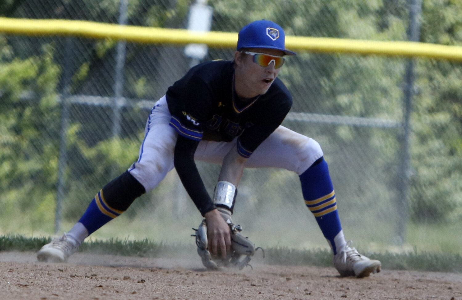 Shortstop Devin Foust corrals the ground ball during last week's game.