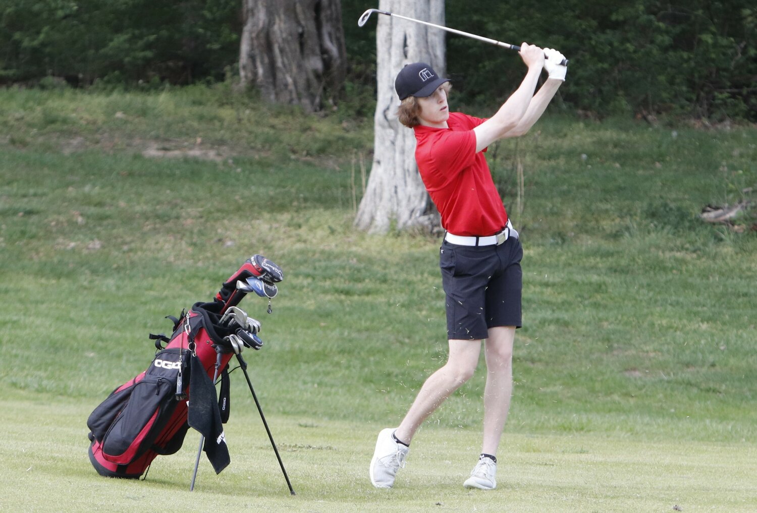 Warrenton junior Troy Anderson follows through after hitting a shot in a dual match against St. Charles West in April. Anderson earned GAC North first team honors.