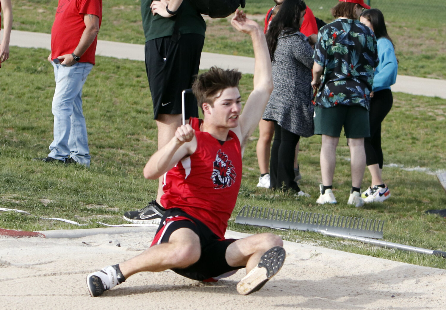 Warrenton senior Colton Brosenne lands in the sand pit during the triple jump competition at last week's GAC North Championships.