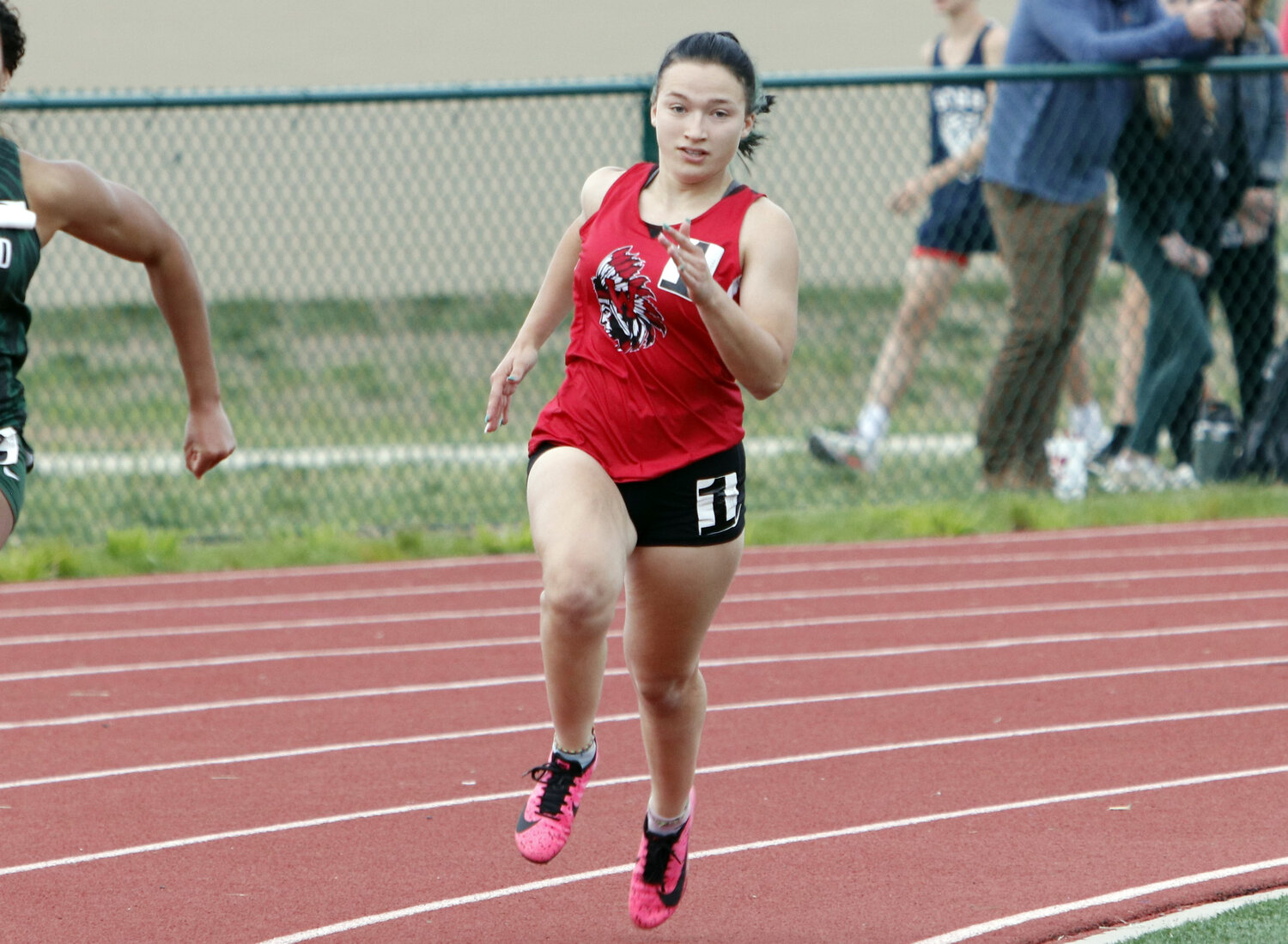 Kylie Overkamp runs towards the finish line during the 200-meter dash competition.
