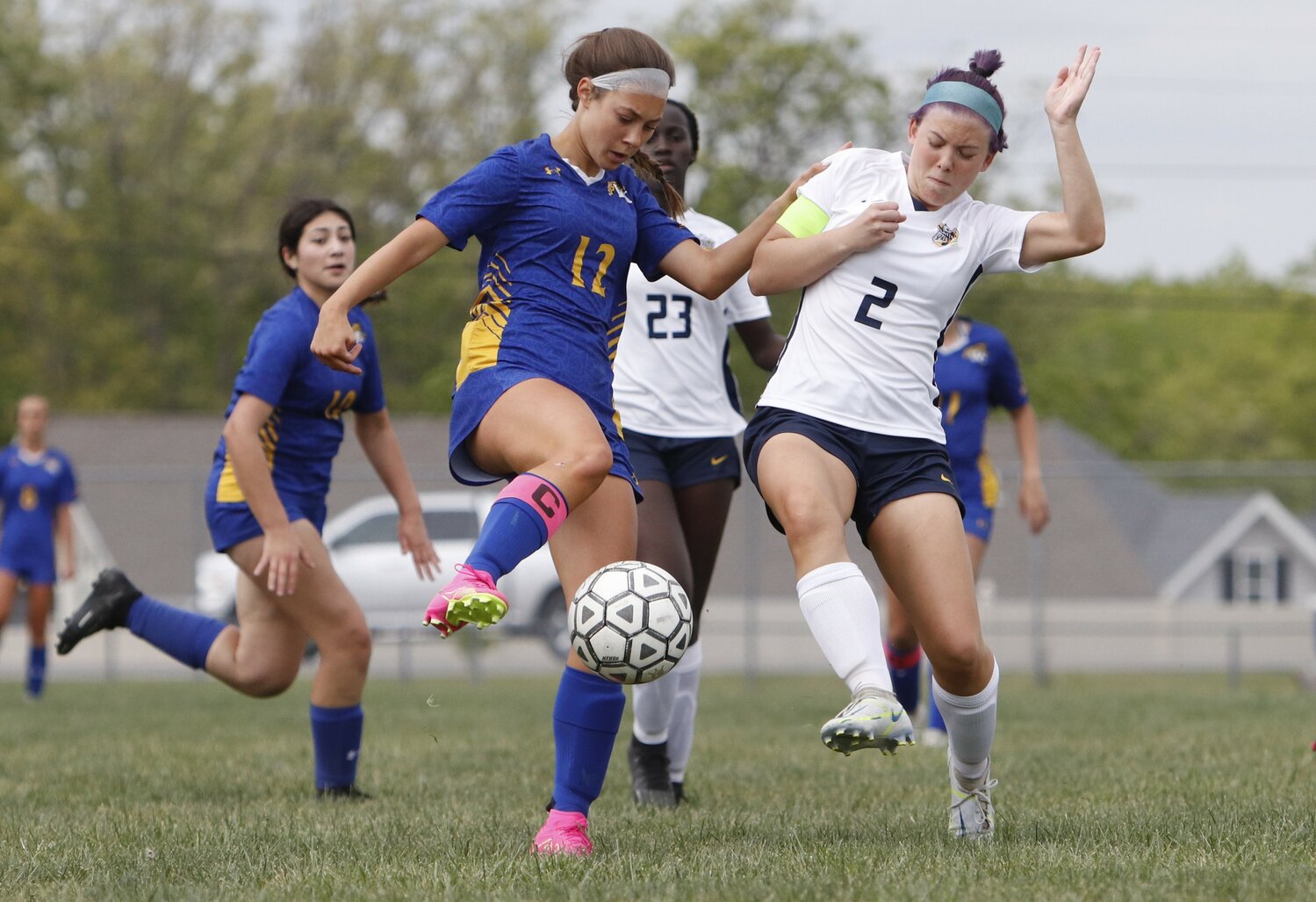 Paige Kirn (left) attempts to keep possession of the ball during last week's game.