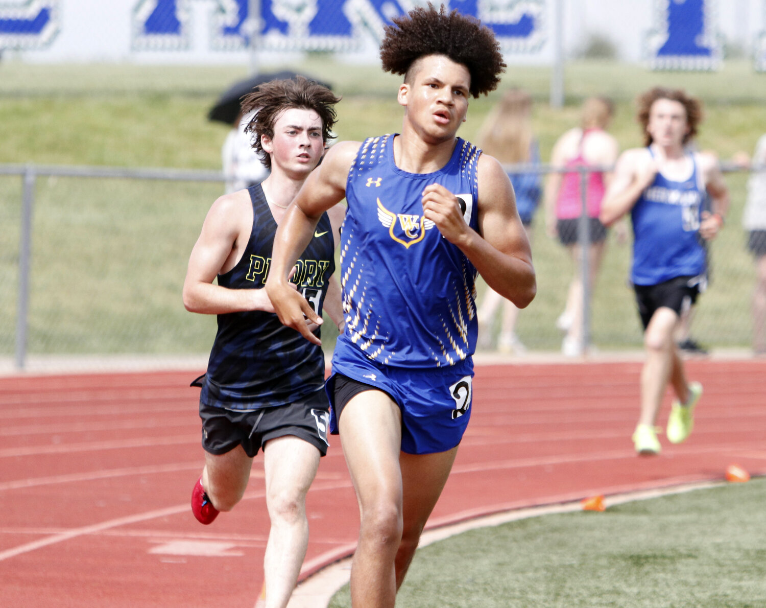 Isaiah Yoder (right) leads a pack of runners during the 1600-meter run at last weekend’s district competition. Yoder will compete in the 1600-meter run and 3200-meter run at this weekend’s sectional meet.