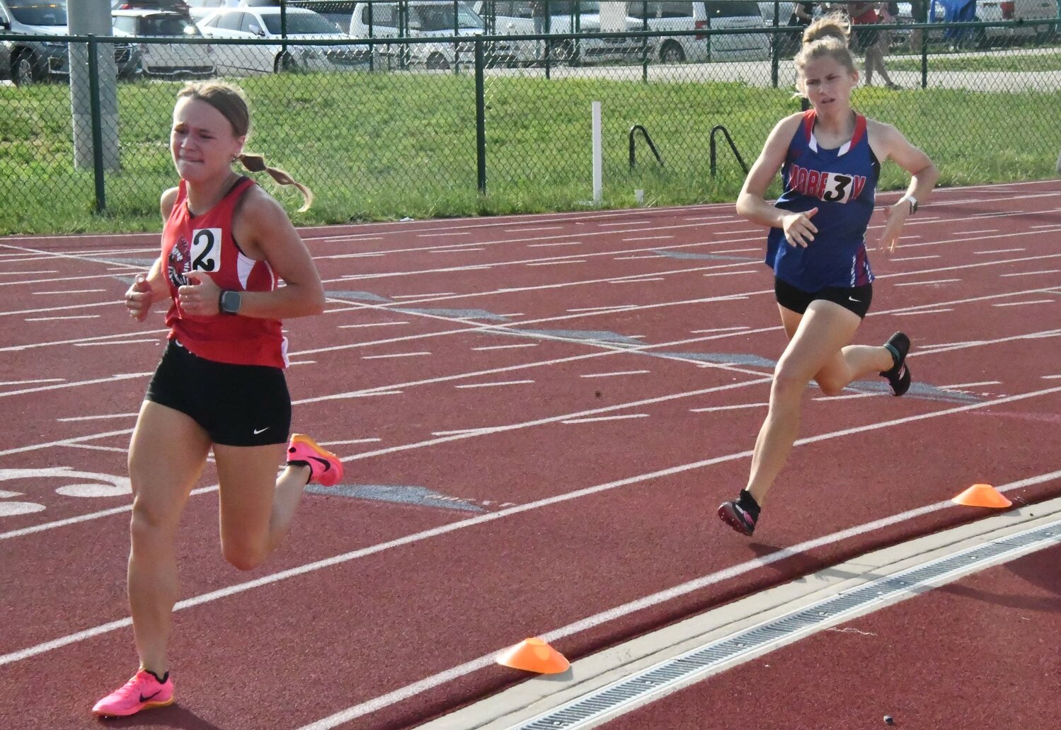 Warrenton senior Madelyn Marschel (left) competes in the 800-meter run at the Class 4, District 4 meet last weekend at North Point High School.
