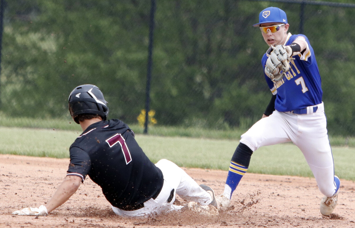 Wright City’s Devin Foust (right) records a force out during Monday’s Class 4, District 6 semifinal.