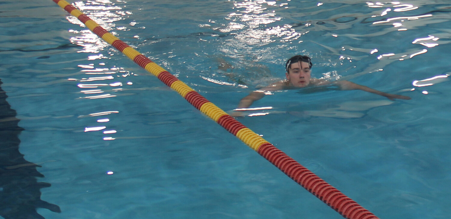 Jacob Nagel swims his warm up laps before the May 19 lifeguard training. Nagel was one of five lifeguard candidates participating in the training.