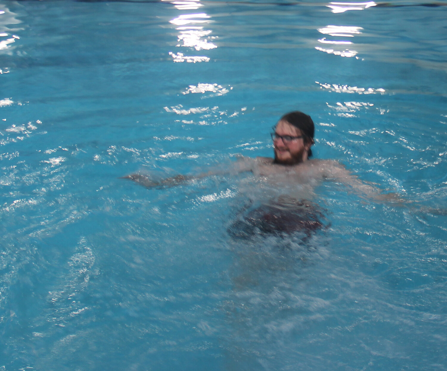 Cole McBride, lifeguard instructor, enjoys a moment in the water during lifeguard training on May 19.