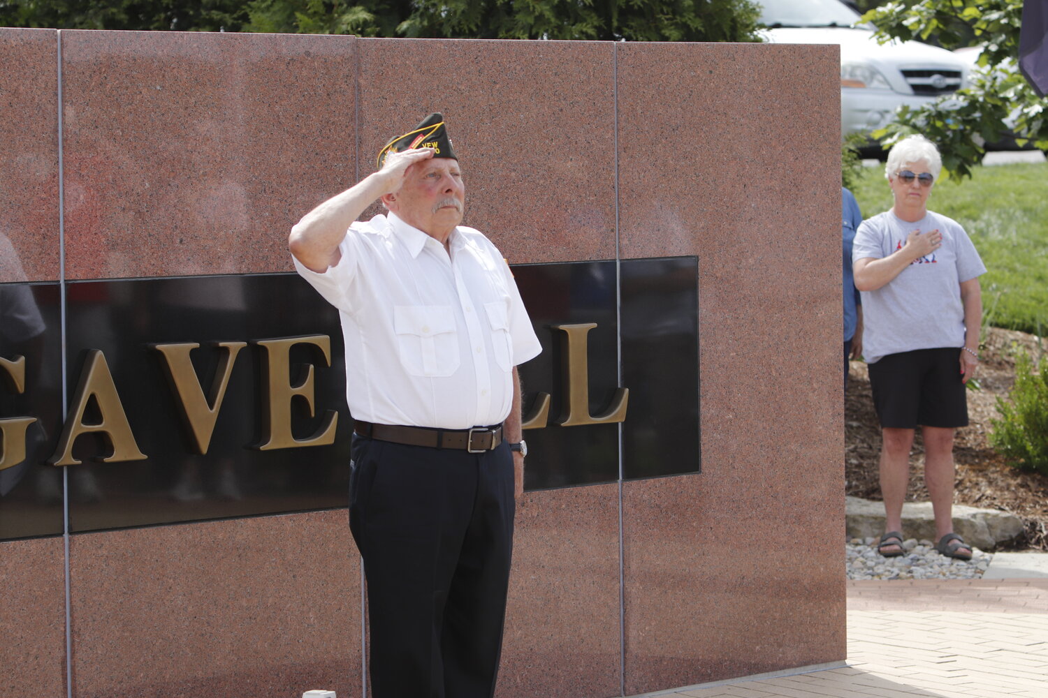 Rick Mantione salutes during the Memorial Day ceremony at the Tribute To Veterans Memorial.
