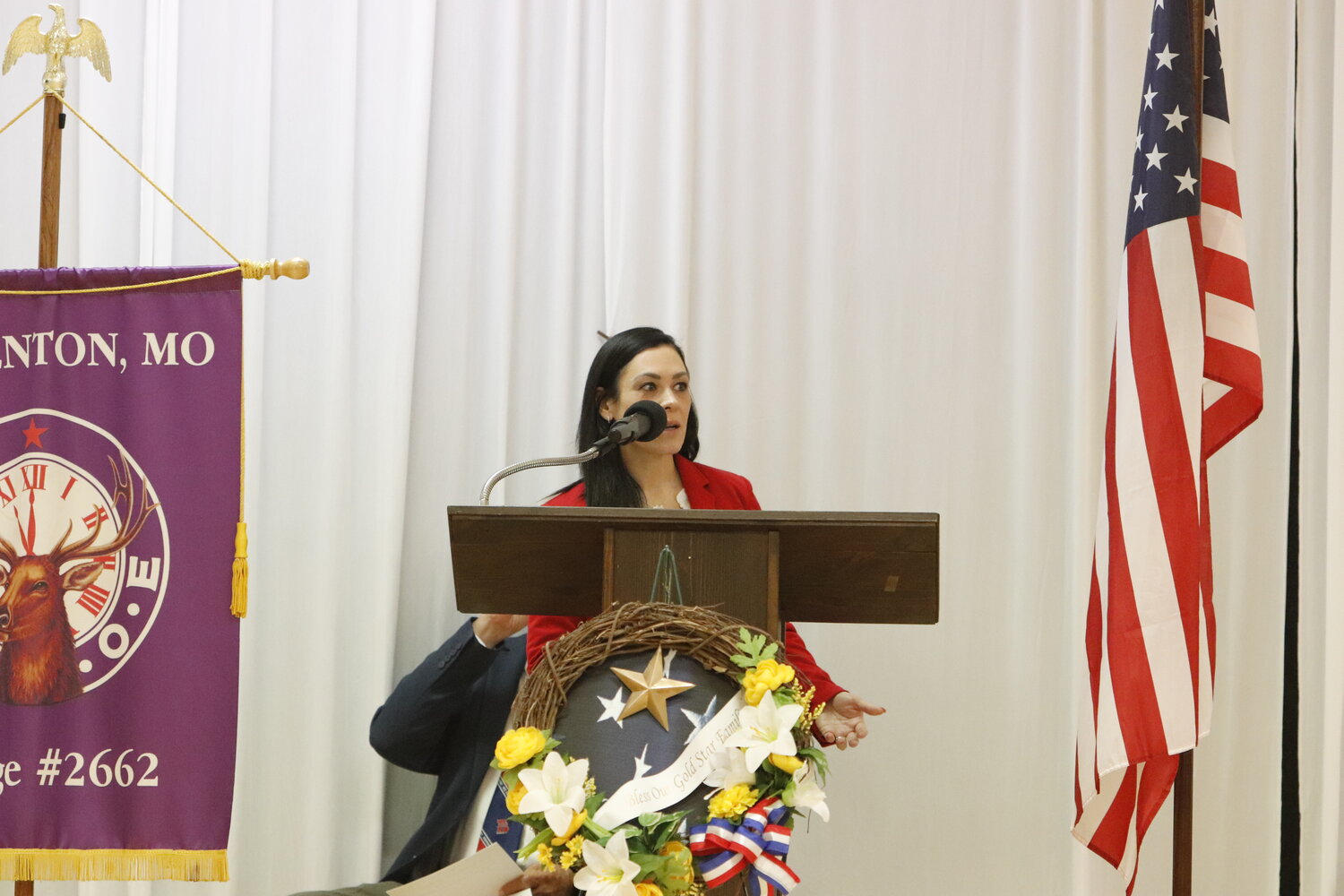 Rebecca Tallman speaks during the end of the Memorial Day Ceremony at Elks Lodge in Warrenton.