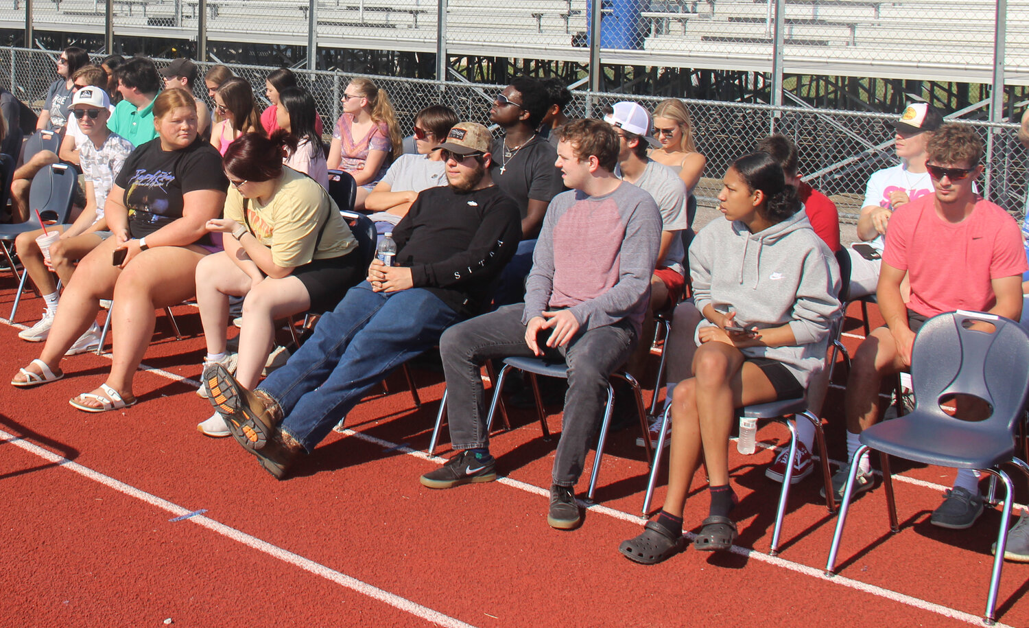 Wright City High School seniors sit in their assigned seats and listen to brief instructions before beginning the graduation rehearsal.