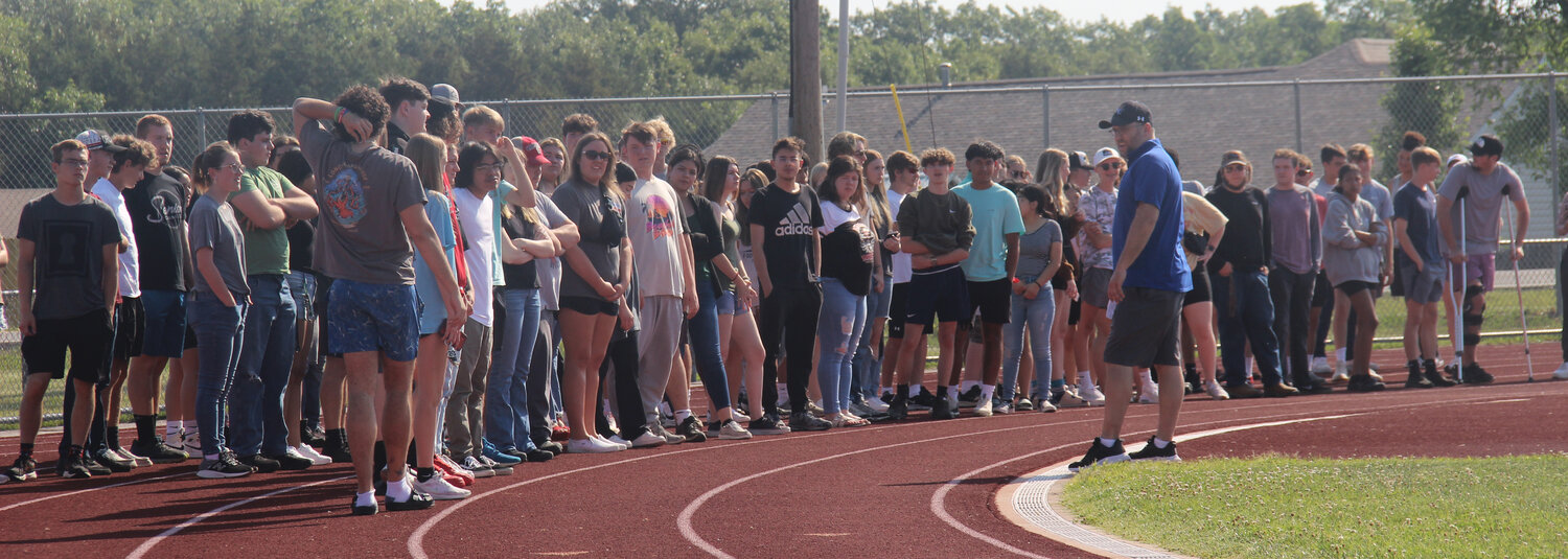 Wright City High School seniors listen to instructions about how the processional will work during the June 2 graduation ceremony.