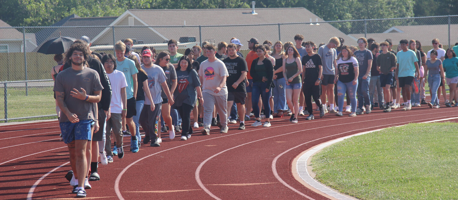 Wright City High School seniors, led by Roman Adaway, begin practicing the processional during graduation rehearsal on June 1.