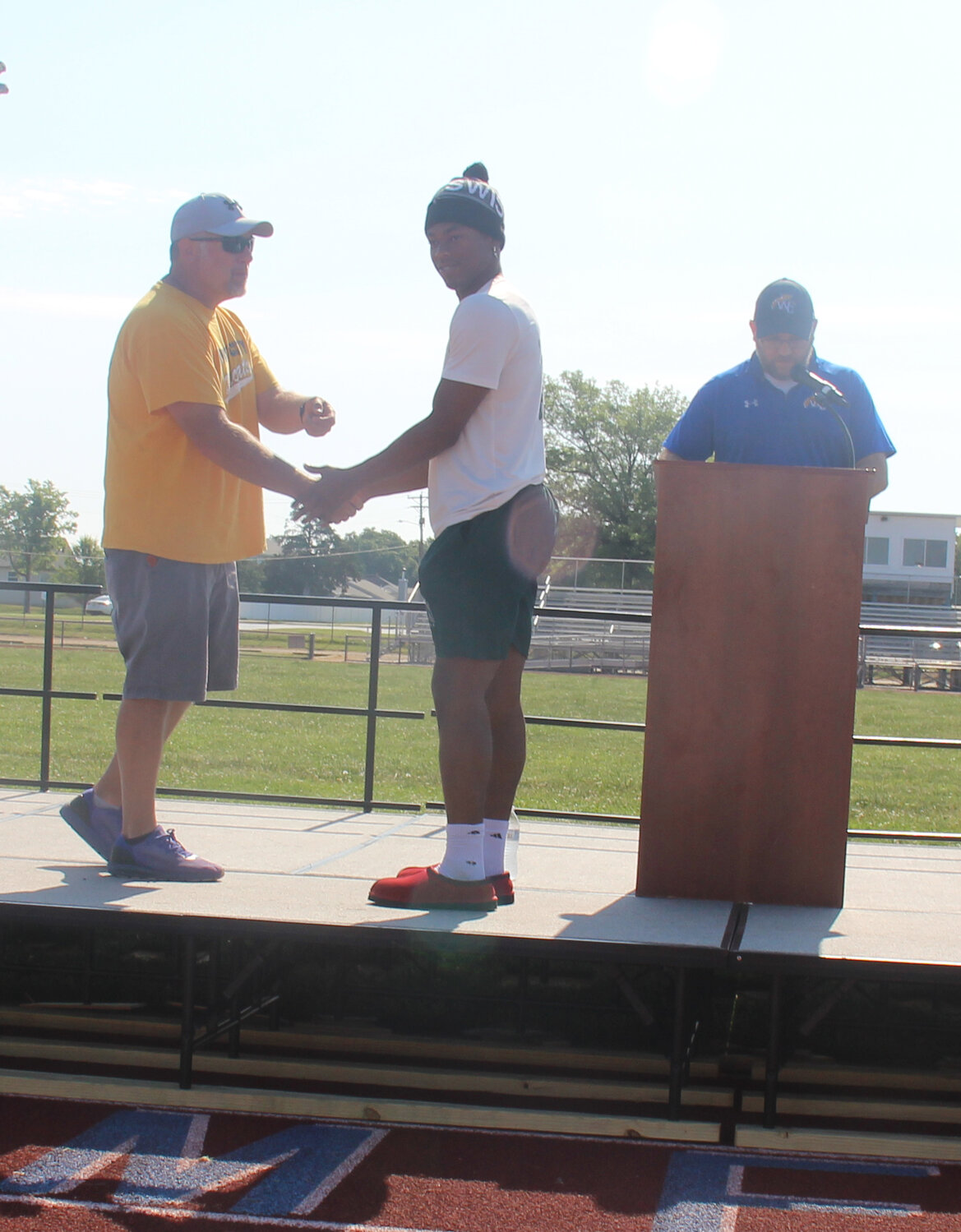 Senior Jeremiah Davis practices accepting his diploma cover during graduation rehearsal on June 1.