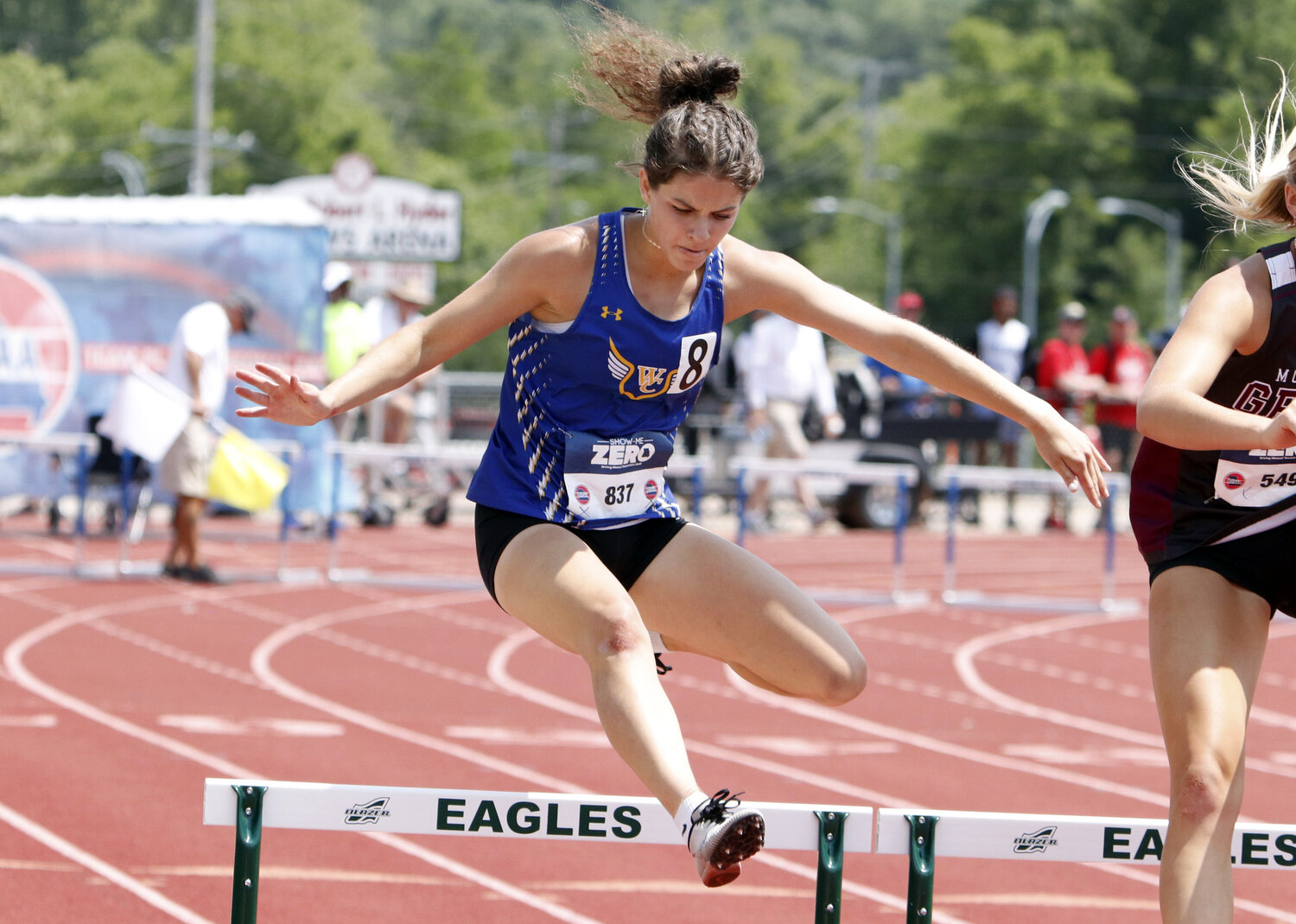 Wright City junior Elizabeth Riggs clears a hurdle during the Class 3 300-meter hurdle finals. Riggs finished the race in sixth place.