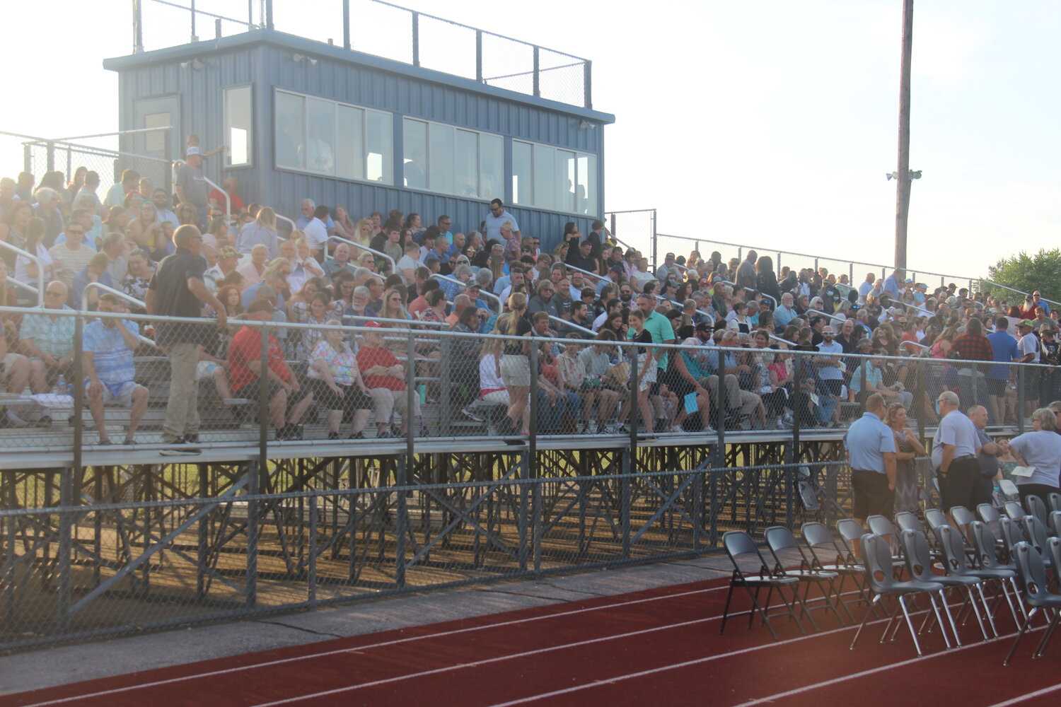 The football bleachers were packed full of excited family members and friends as they wait for the Wright City High School graduation ceremony to begin.