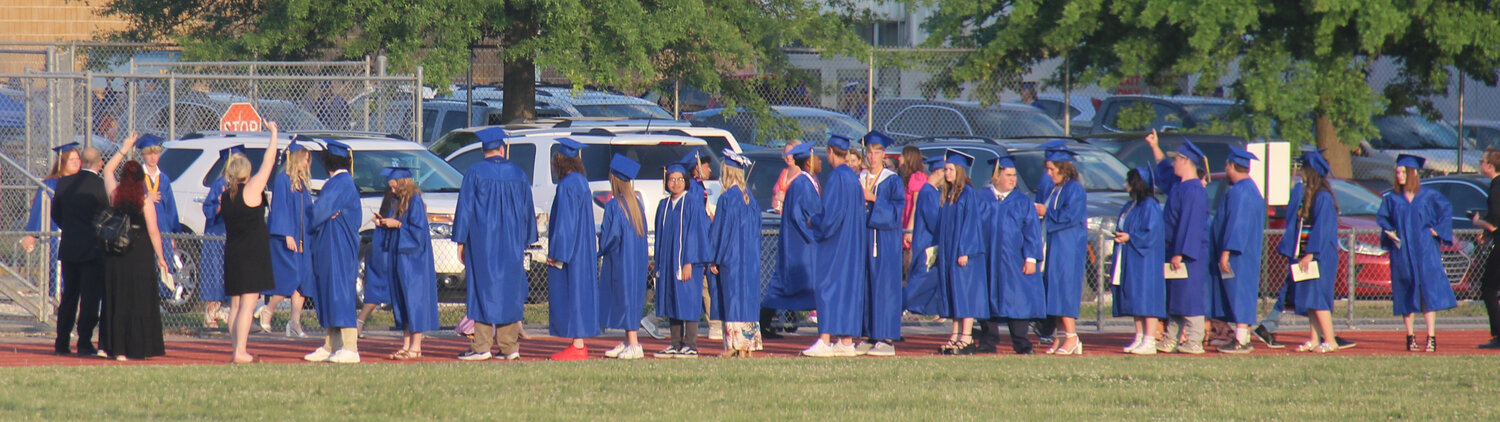 The Class of 2023 begins to lineup on the track surrounding the Wright City High School football field as they prepare for the processional.