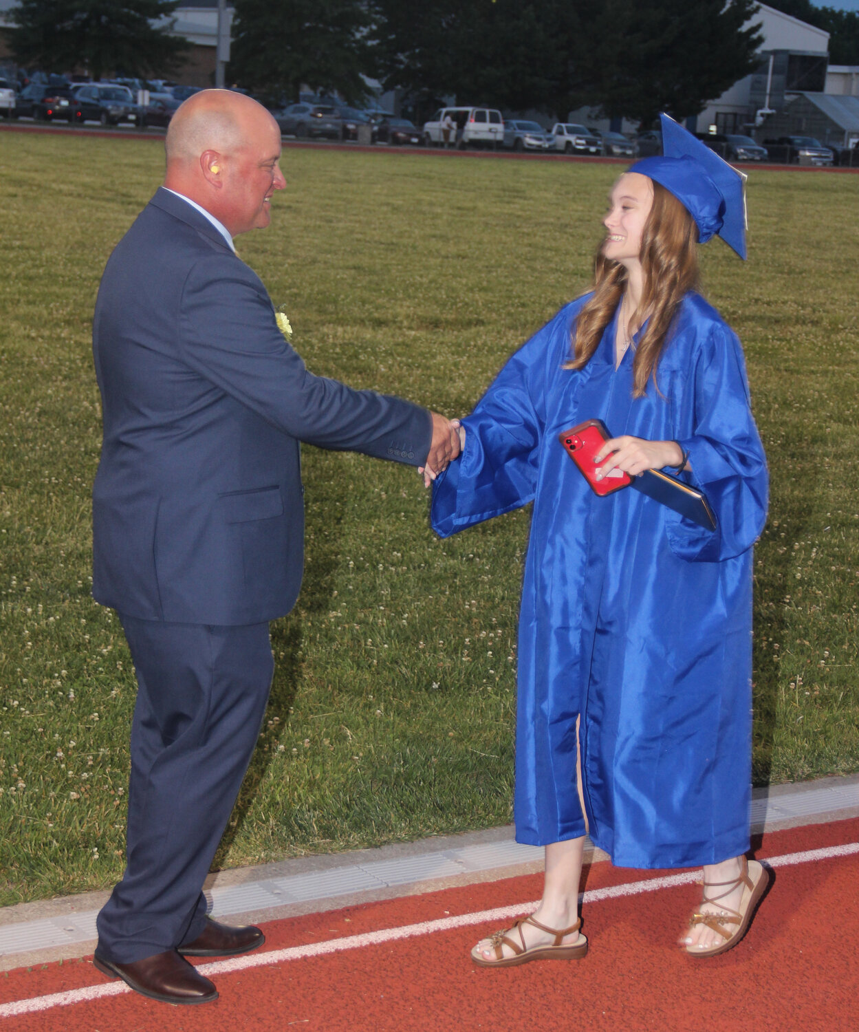 Sophia Badalamenti shakes hands with Principal Matt Brooks after she walked across the stage during the Wright City High School graduation ceremony.