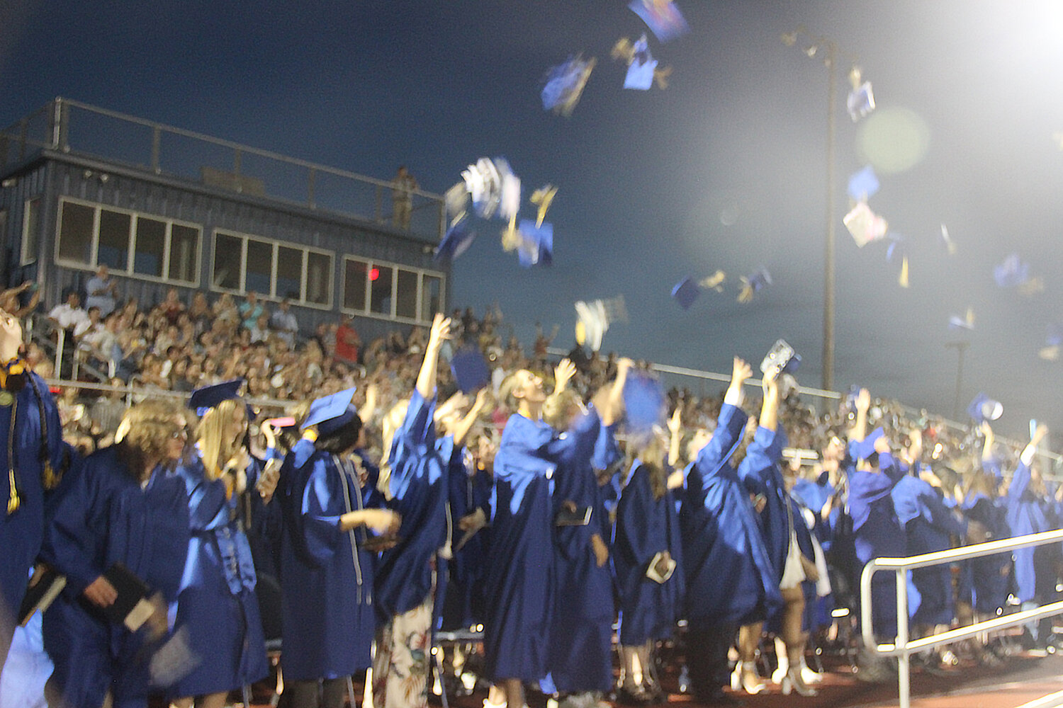 The newest Wright City High School alumni toss their caps into the air at the end of the graduation ceremony on June 2.