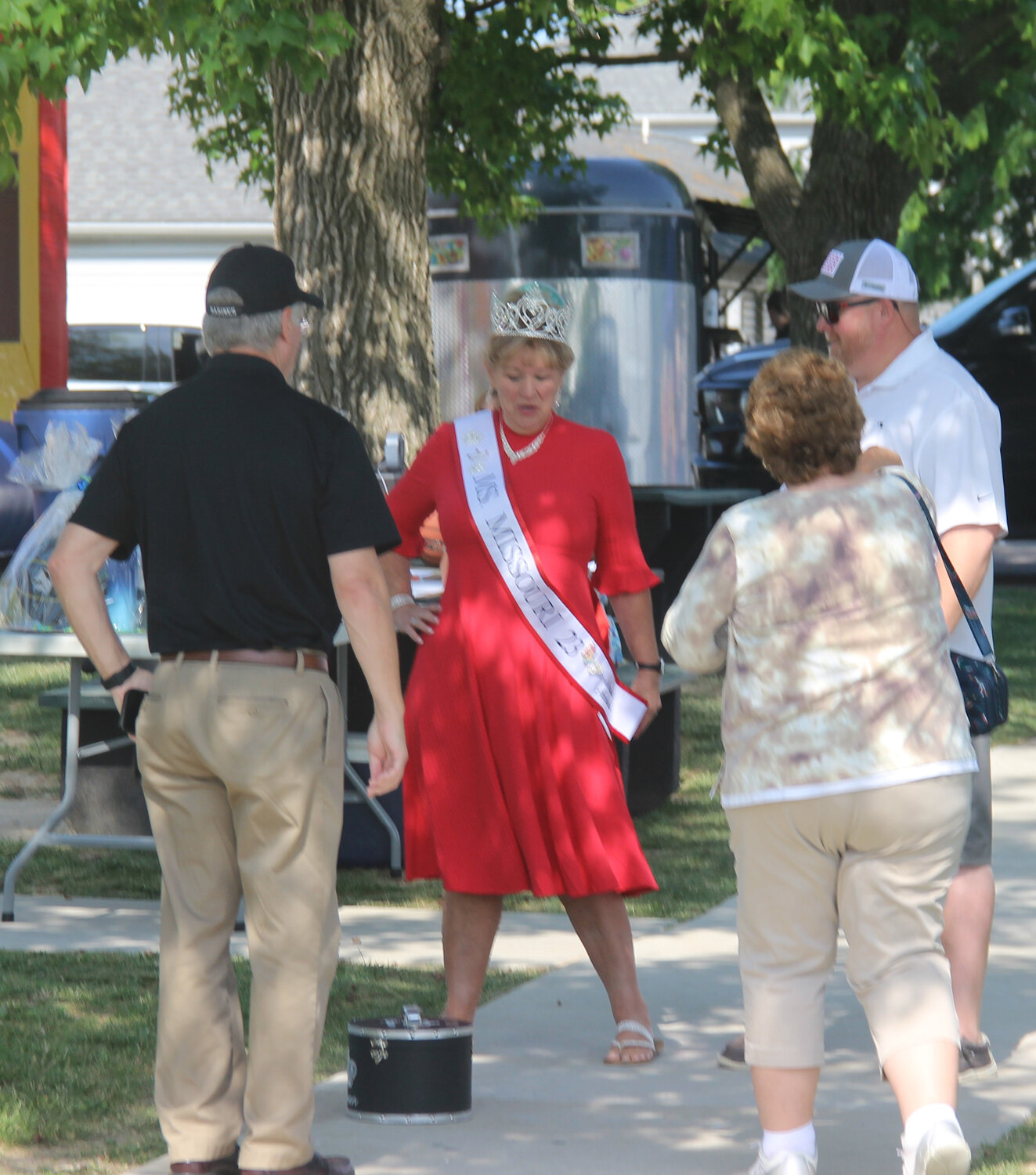 Christy Wilson-Smith, Ms. Missouri Senior America 2023, greets Truesdale Mayor Chris Watson at the start of Summerfest.