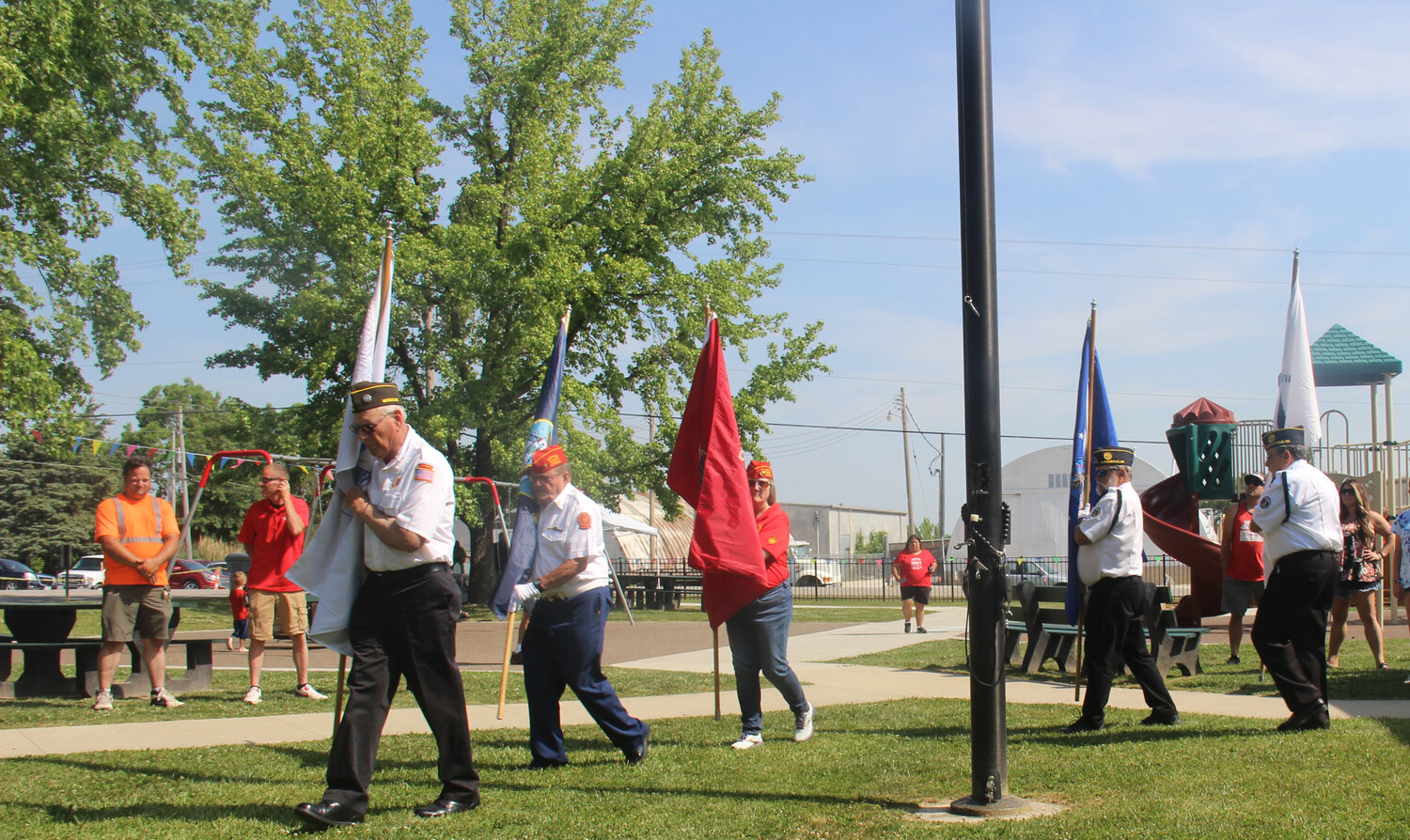 The Honor Guard carries the flags of the U.S. military branches during the Summerfest opening ceremonies.